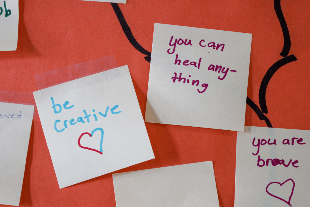 Encouraging notes written by Guadalupe School students saying, "Be creative," "You can heal anything," and "You are brave." 